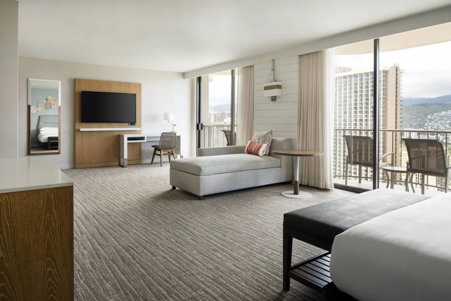 City View Junior Suite with balcony seating at Waikiki Beach Marriott Resort & Spa.