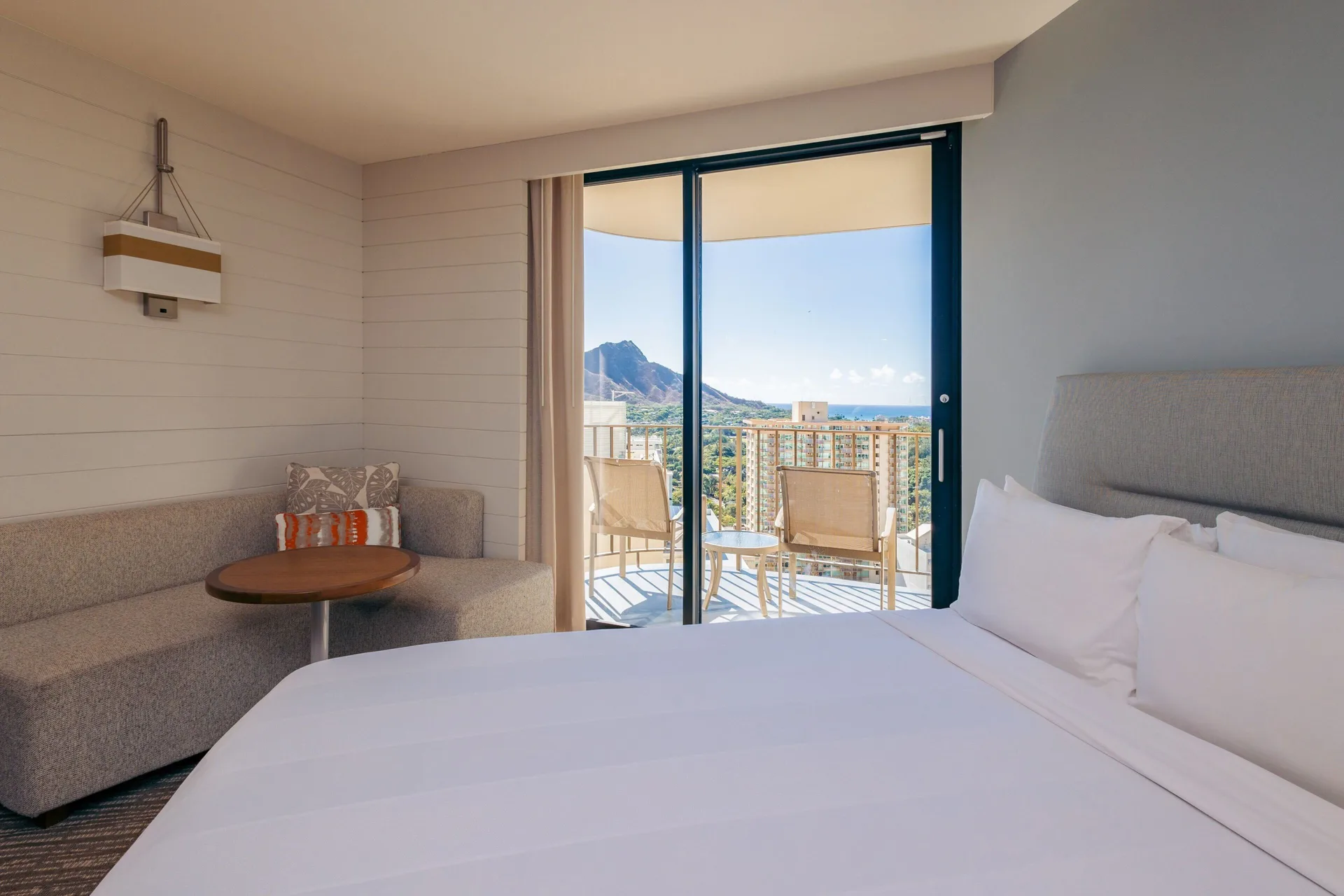 Diamondhead Ocean View guest room with king bed at Waikiki Beach Marriott Resort & Spa.