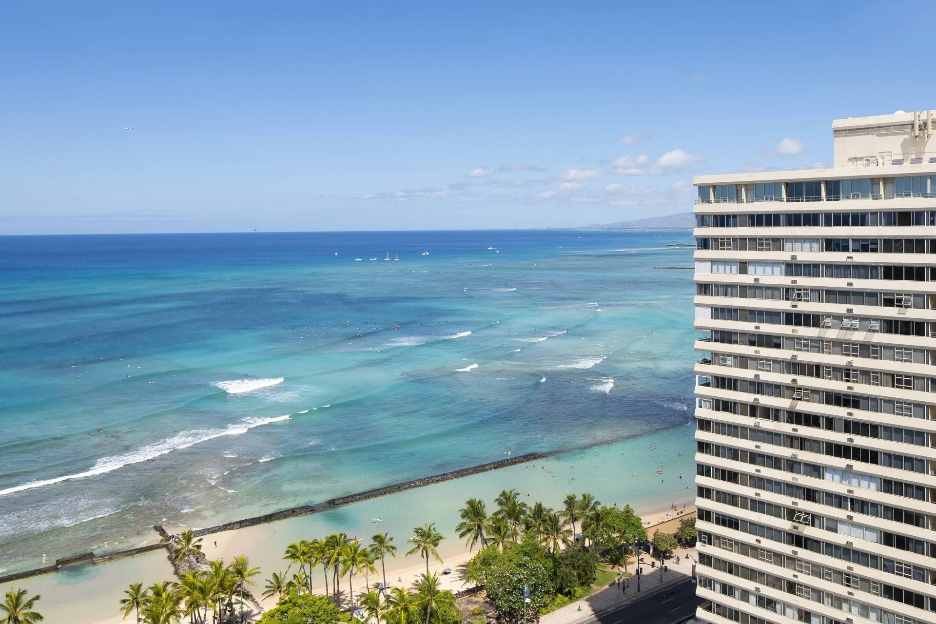 Ocean and Waikiki shoreline view from a suite balcony at Waikiki Beach Marriott Resort & Spa.