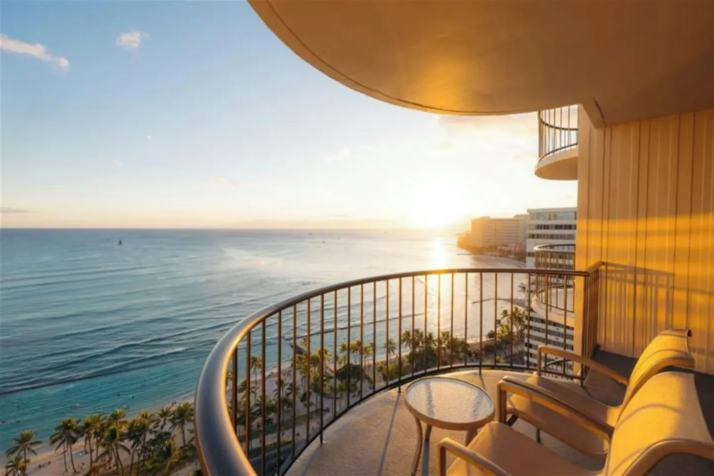 Ocean front balcony at sunset at Waikiki Beach Marriott Resort & Spa.