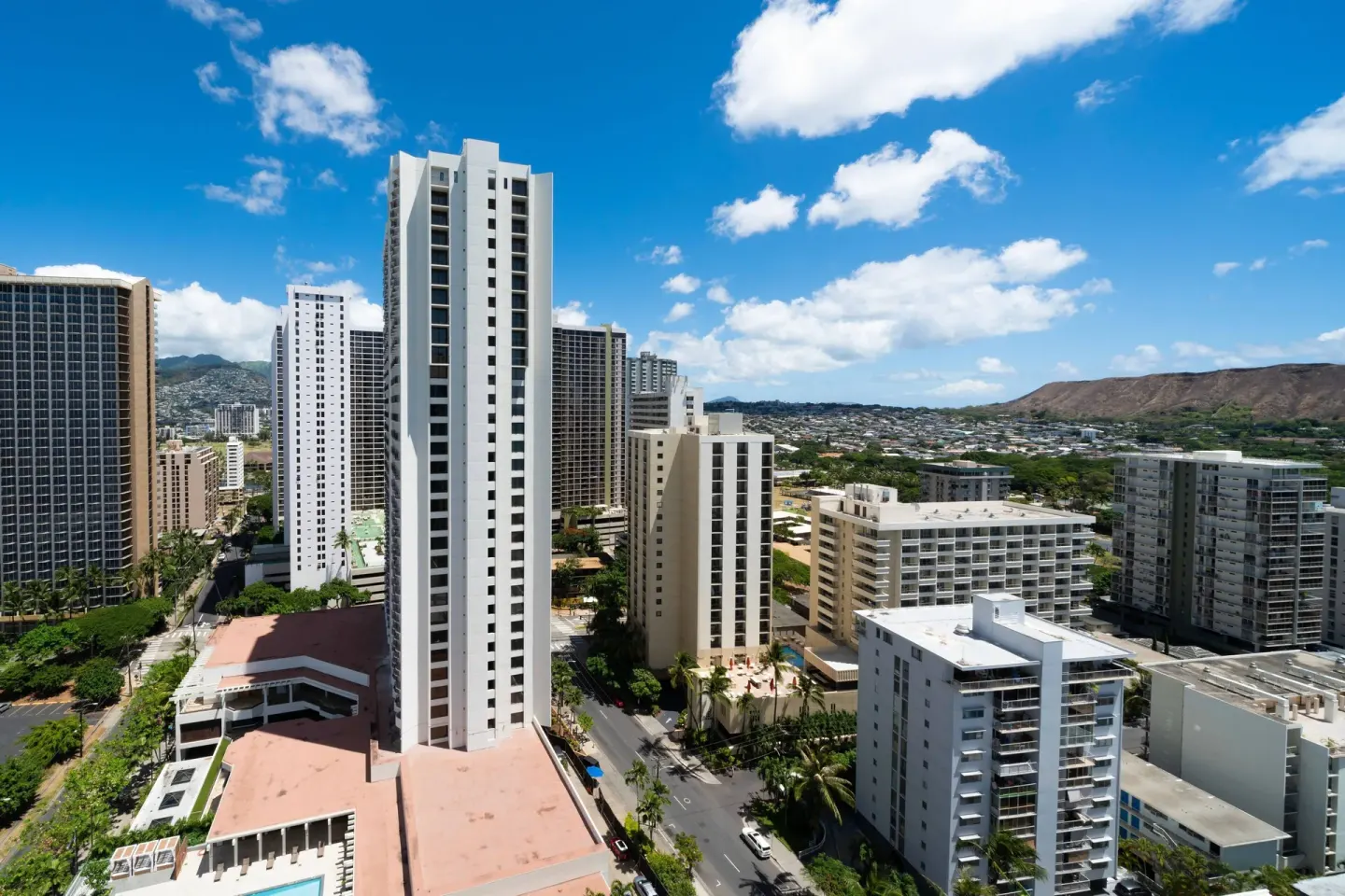 City view from a guest room at Waikiki Beach Marriott Resort & Spa with towers and Diamond Head in the distance.