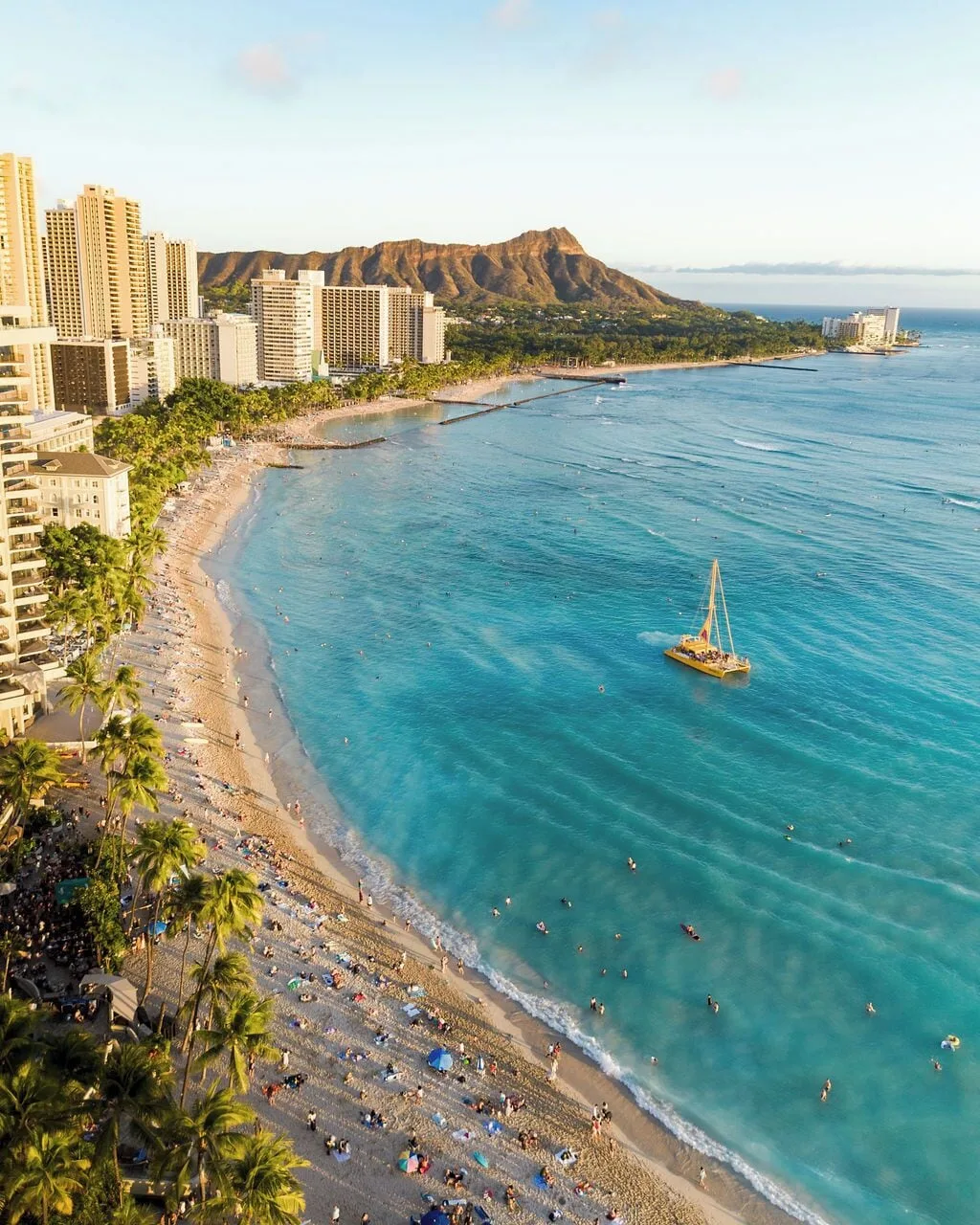 Aerial Waikiki shoreline with Diamond Head and blue water near Waikiki Malia.