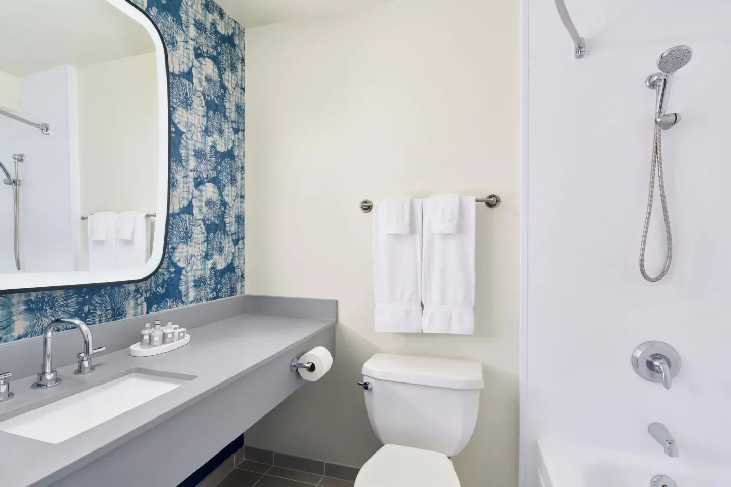 City View room bathroom with vanity, toilet, and shower at Waikiki Malia.