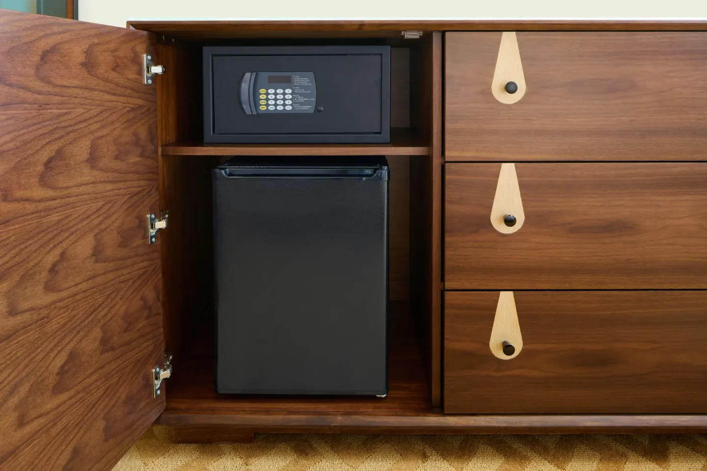 City View room dresser with in-room safe and mini refrigerator at Waikiki Malia.