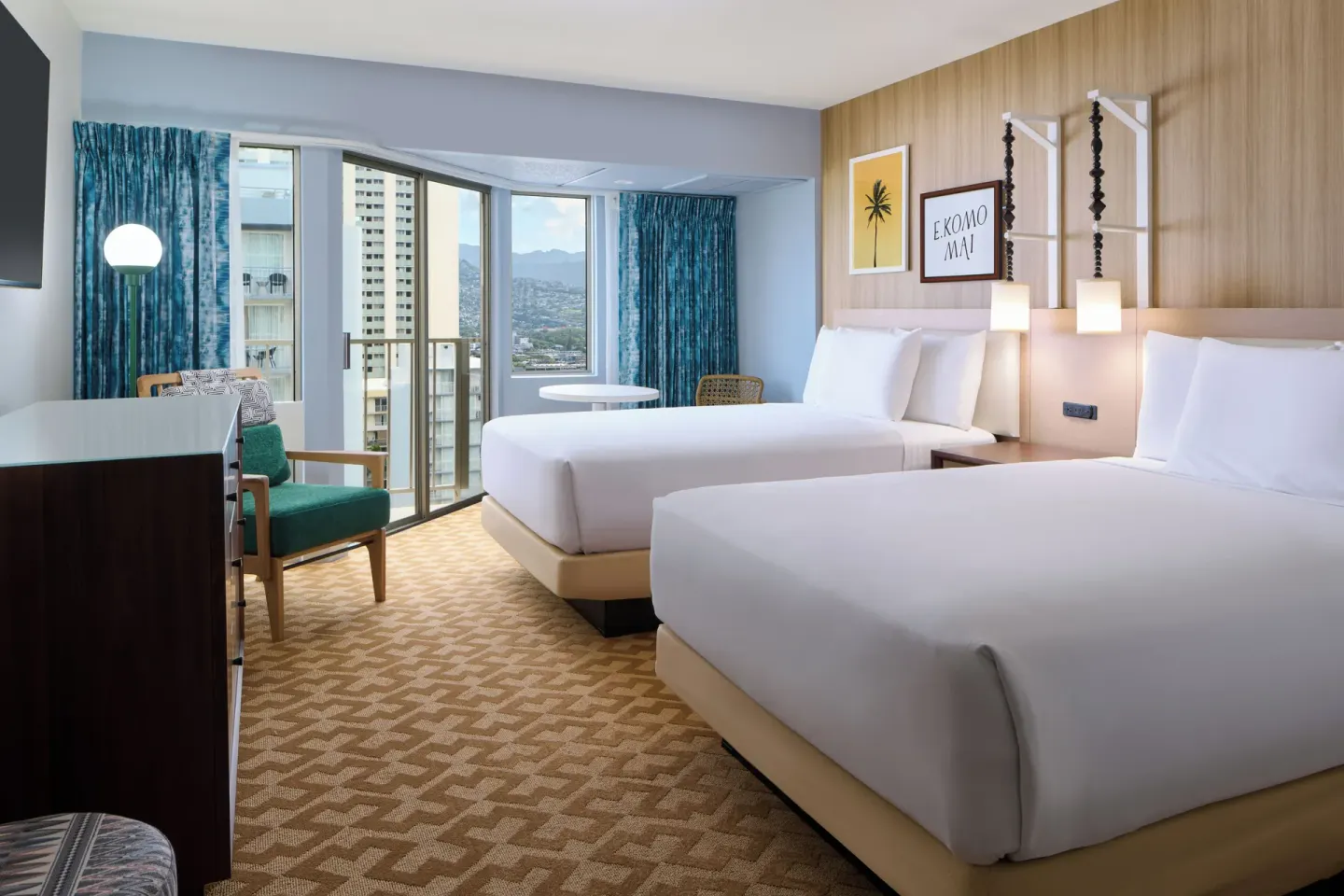 City View room with two beds, seating, balcony doors, and mountain glimpse at Waikiki Malia.