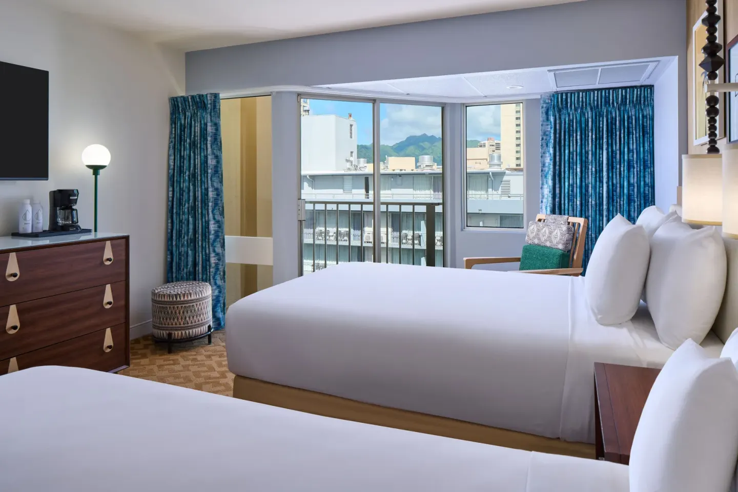 City View guest room with two beds, balcony, and dresser at Waikiki Malia.