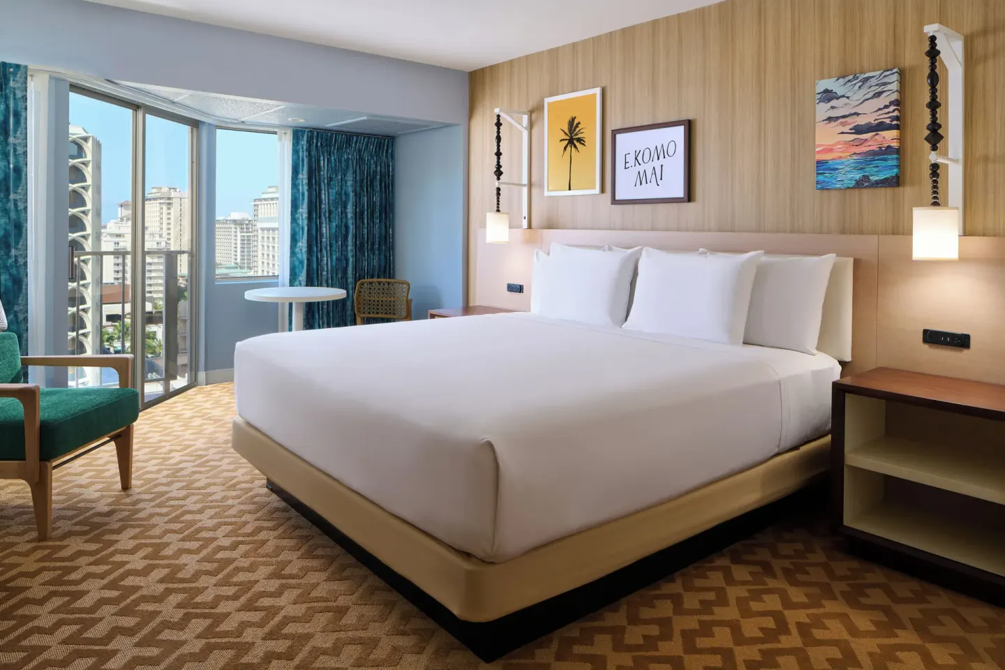 Partial Ocean View room with a king bed, balcony, and city view at Waikiki Malia.