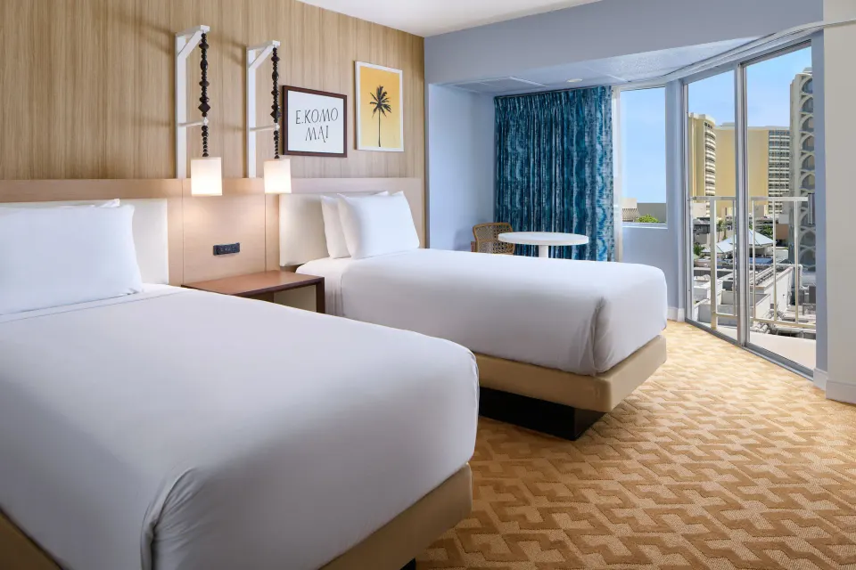 Two-bed Partial Ocean View guest room with balcony at Waikiki Malia.