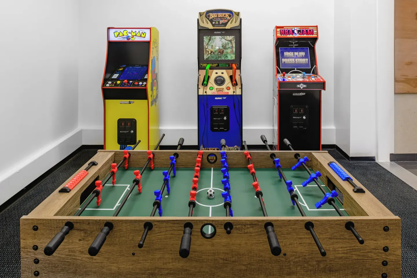 Foosball and arcade game machines are arranged in a game room at Waikiki Resort Hotel.