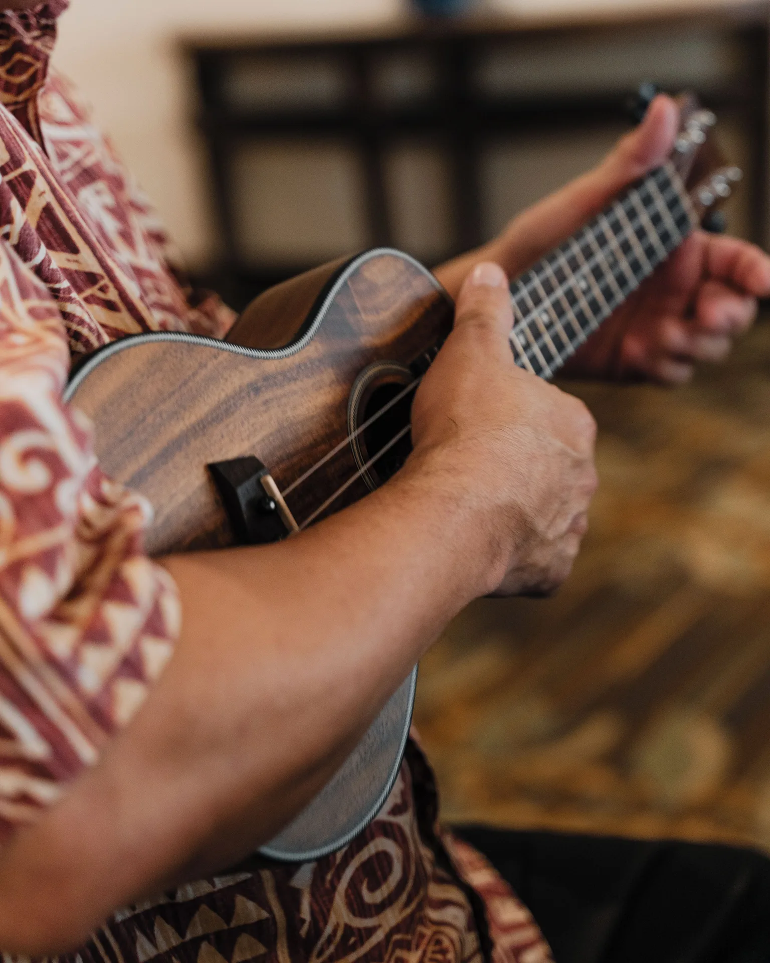 A musician plays a ukulele at Waikiki Resort Hotel.