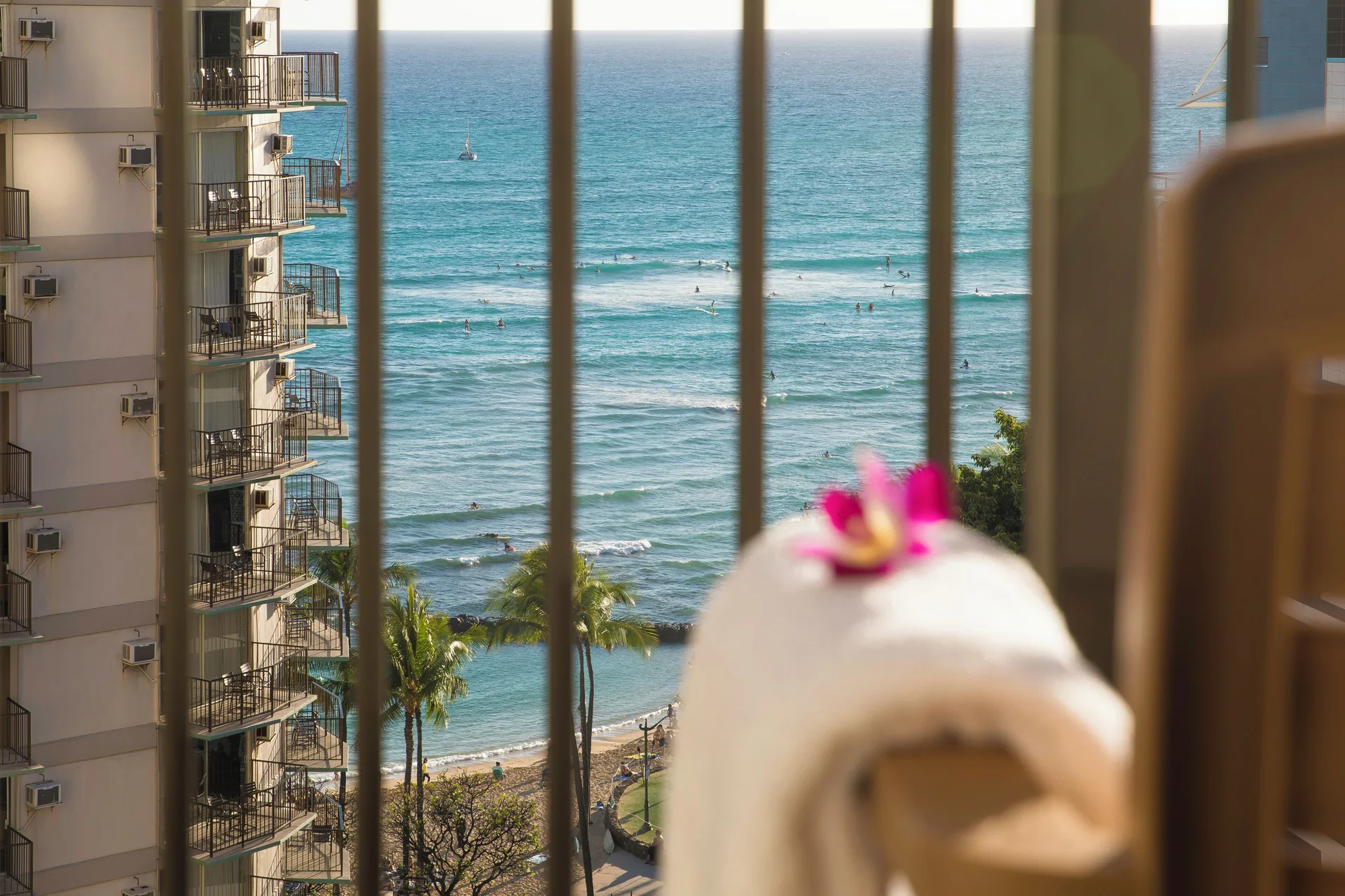 Partial ocean view through balcony railings from a room at Waikiki Resort Hotel.