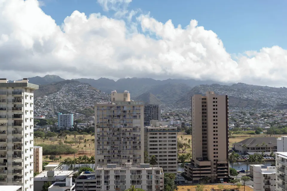 Mountain view from a Suite Mountain View at Waikiki Resort Hotel over nearby buildings.