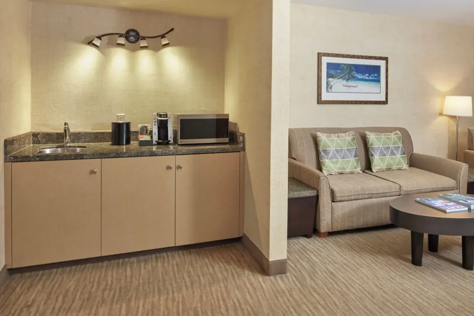 Suite Mountain View wet bar and sofa seating at Waikiki Resort Hotel.