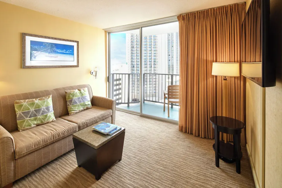 Superior Studio with Den seating area and balcony at Waikiki Resort Hotel.