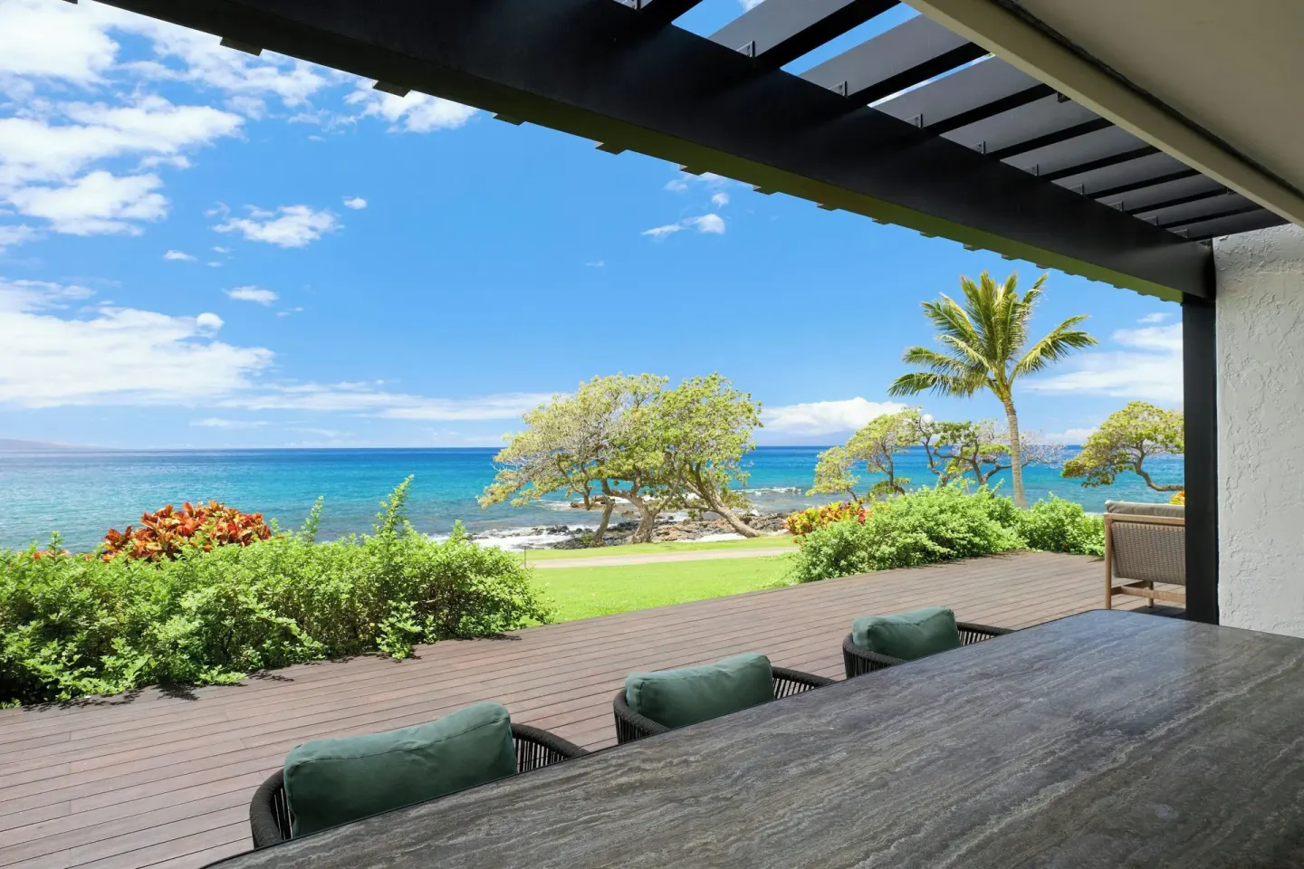 Covered terrace dining table with ocean view at Wailea Beach Resort - Marriott, Maui.