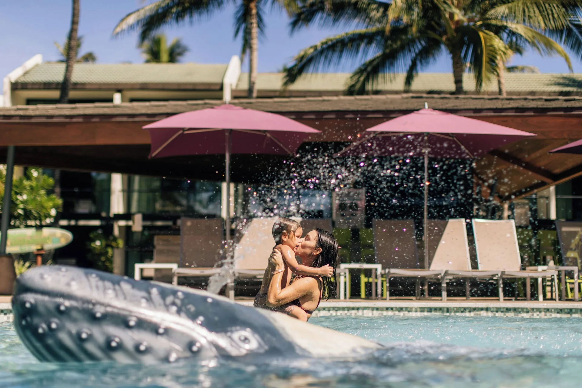 A woman and child play in the pool at Wailea Beach Resort - Marriott, Maui.