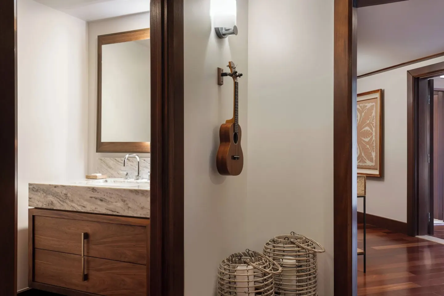 Guest suite entry with vanity, ukulele, and wood floors at Wailea Beach Resort - Marriott, Maui.