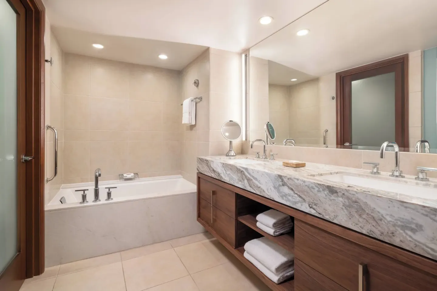 Marble bathroom with soaking tub and double vanity at Wailea Beach Resort - Marriott, Maui.