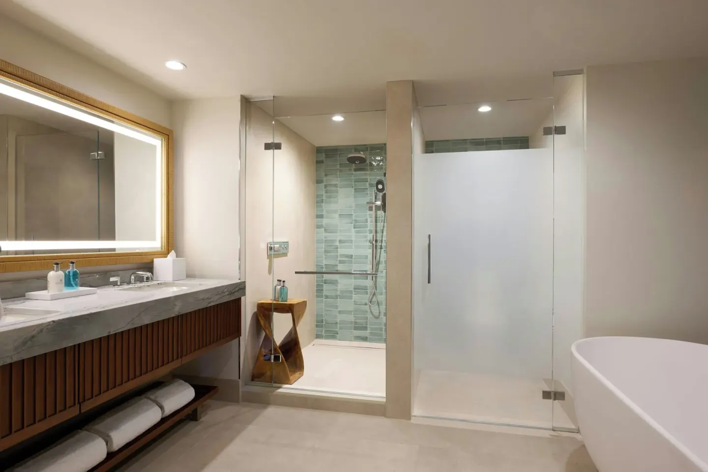 Modern bathroom with glass shower and freestanding tub at Wailea Beach Resort - Marriott, Maui.
