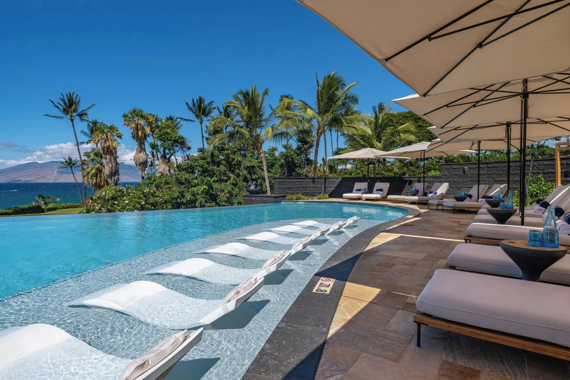 Ocean-view pool with in-water loungers at Wailea Beach Resort - Marriott, Maui.