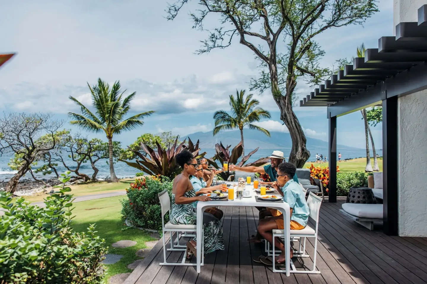Family dines on an oceanfront terrace at Wailea Beach Resort - Marriott, Maui.