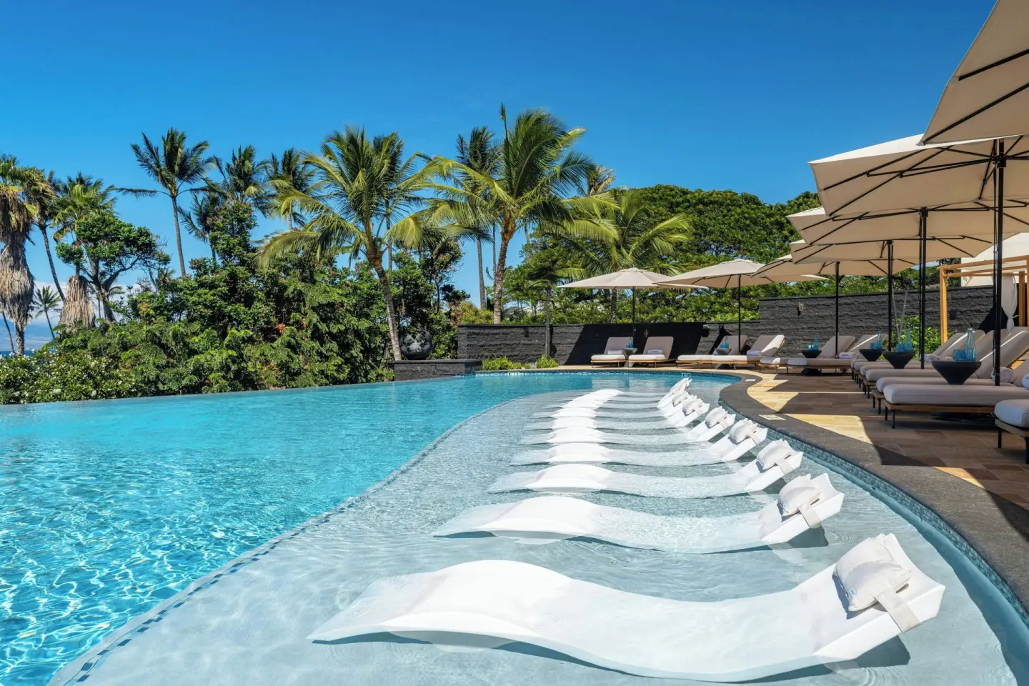 Resort pool with in-water lounge chairs at Wailea Beach Resort - Marriott, Maui.