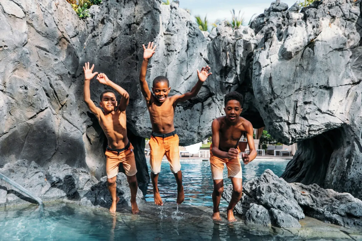 Children jump into the rock-lined pool at Wailea Beach Resort - Marriott, Maui.