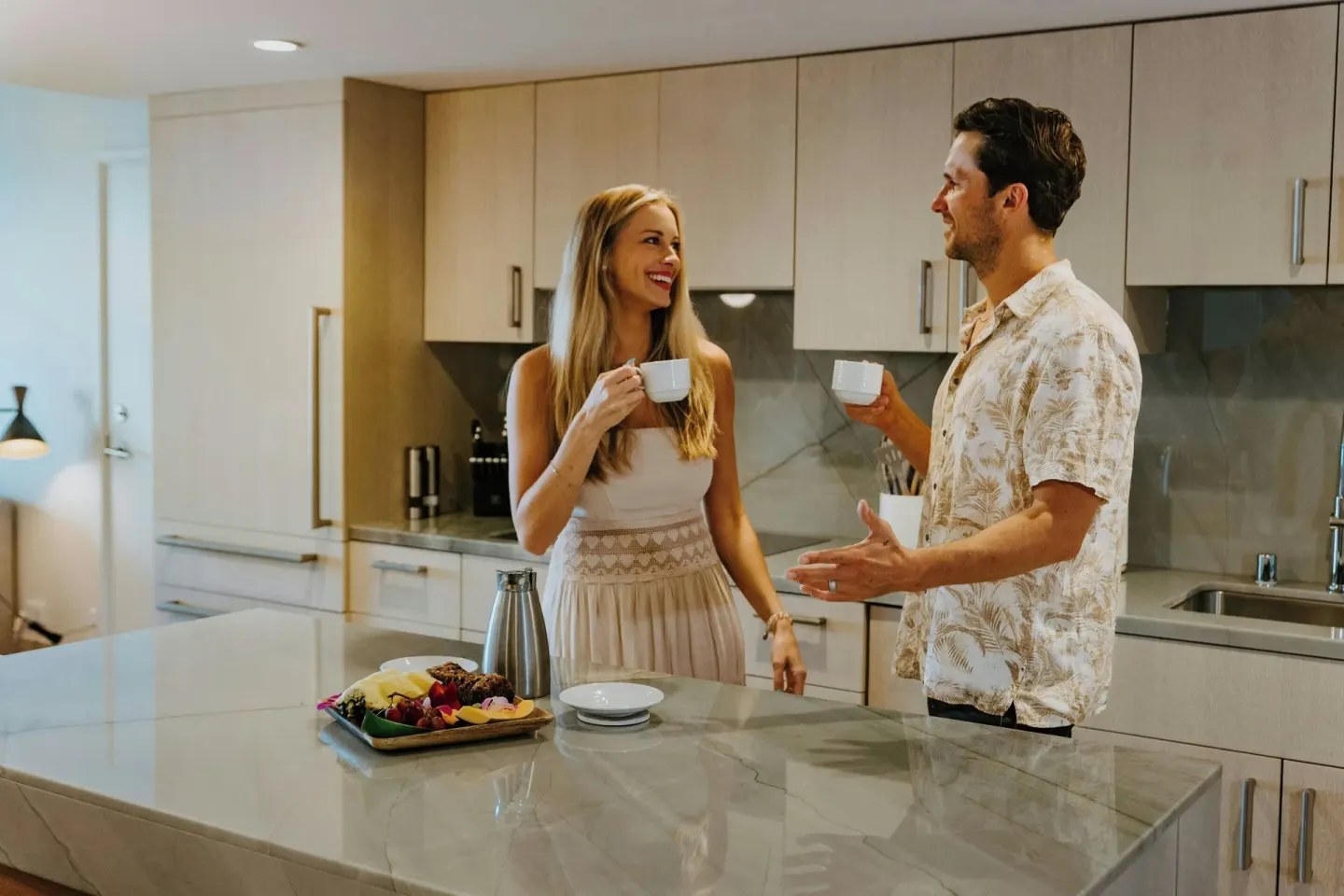 Guests with coffee in a suite kitchen at Wailea Beach Resort - Marriott, Maui.