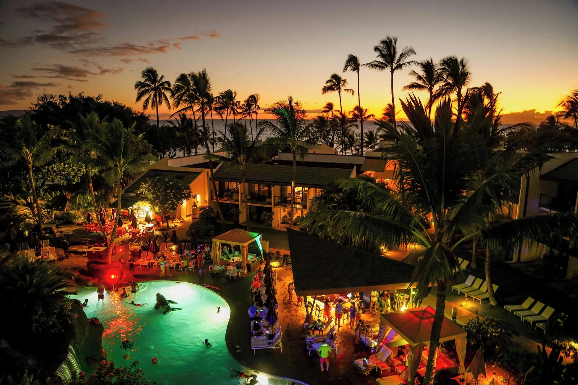 Sunset glows over a pool courtyard at Wailea Beach Resort - Marriott, Maui.