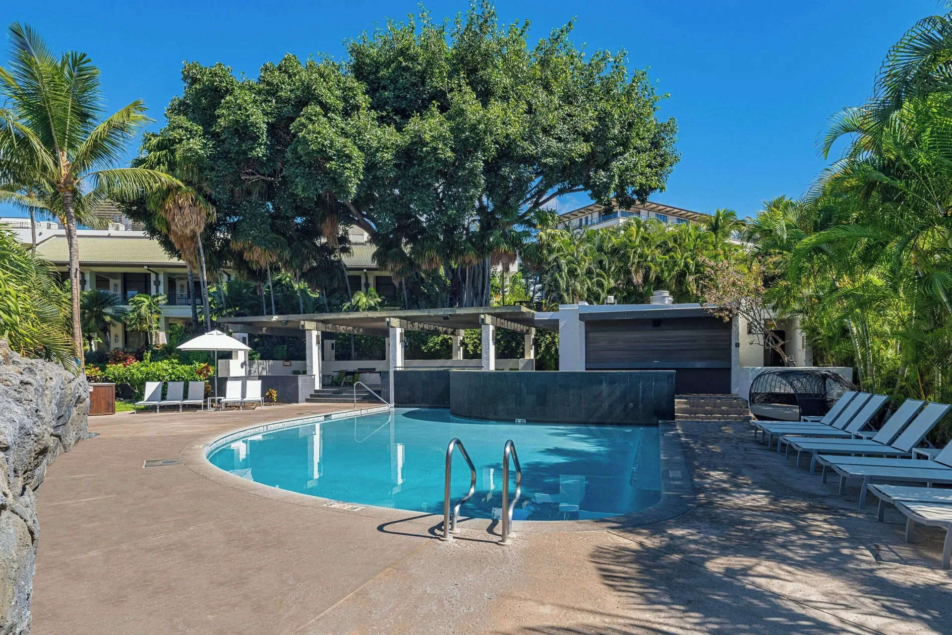 A quiet resort pool with loungers and tropical landscaping at Wailea Beach Resort - Marriott, Maui.