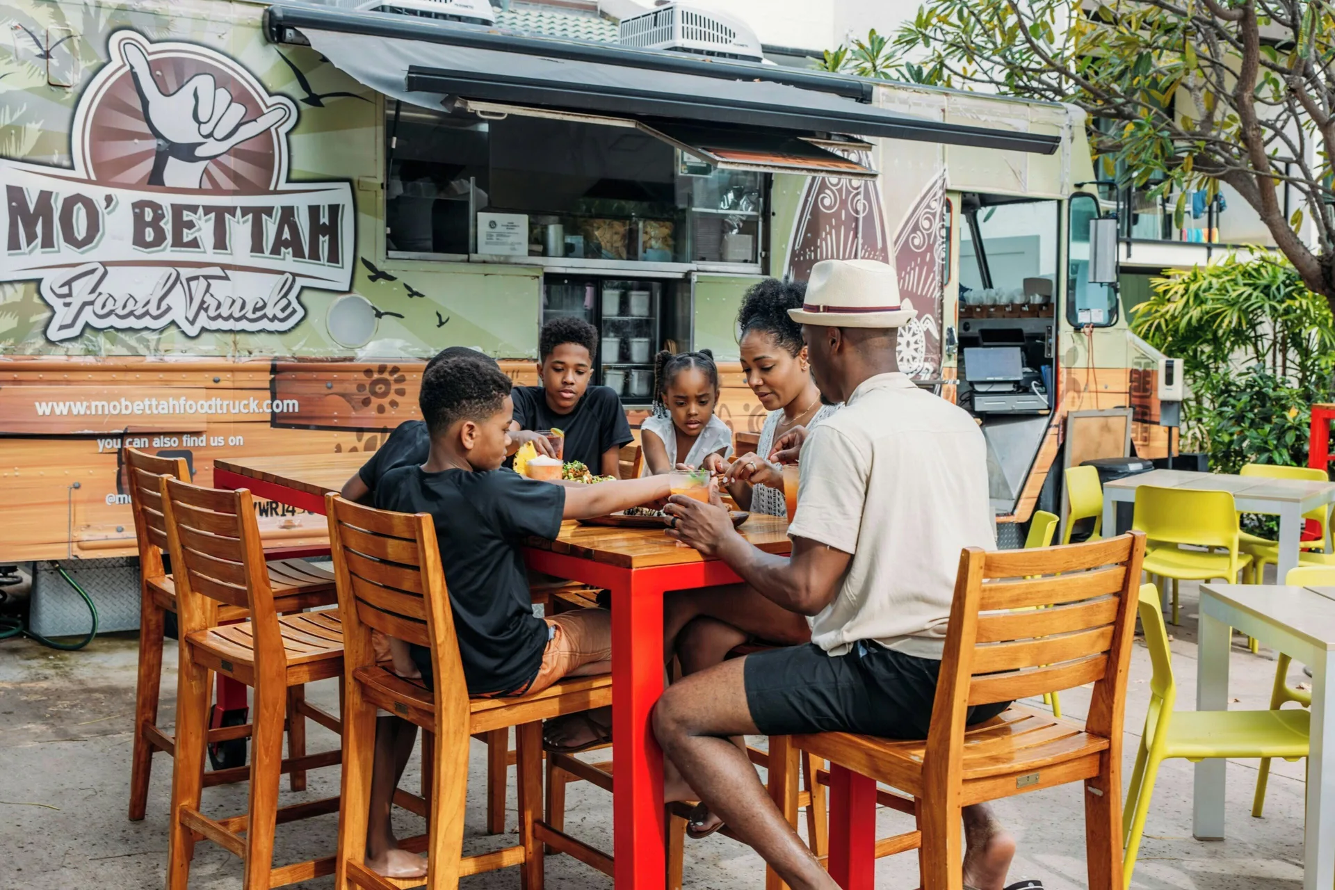 Family dining beside the Mo' Bettah Food Truck at Wailea Beach Resort - Marriott, Maui.