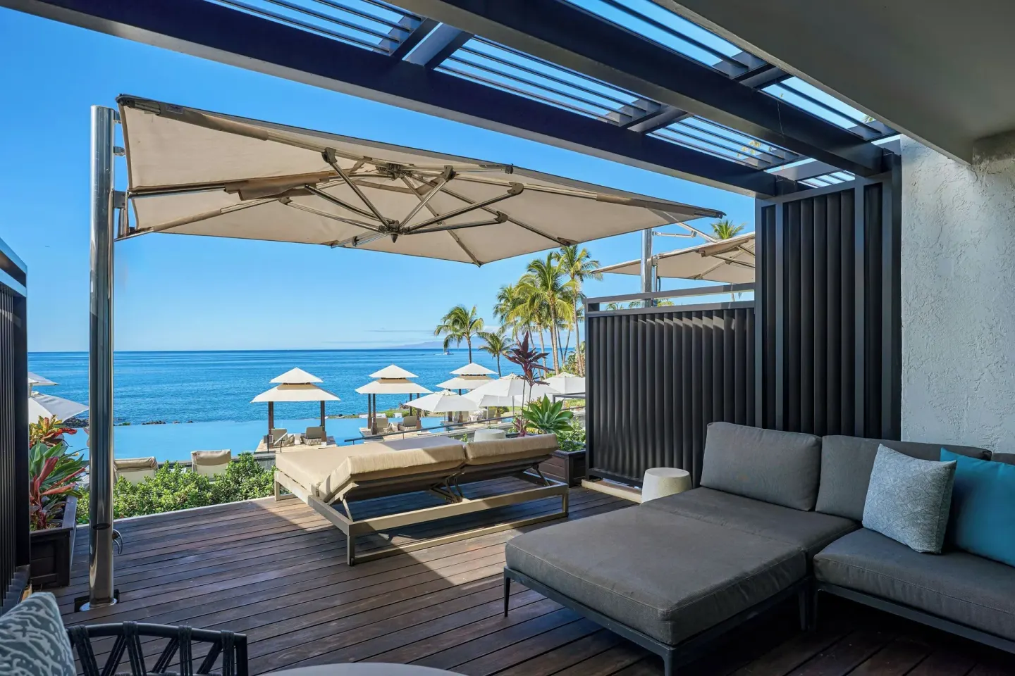 Premium room sundeck with lounge seating and ocean views at Wailea Beach Resort - Marriott, Maui.