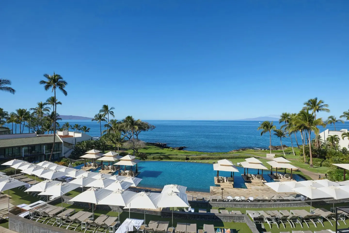 Ocean-view balcony vista over the pool and Pacific at Wailea Beach Resort - Marriott, Maui.