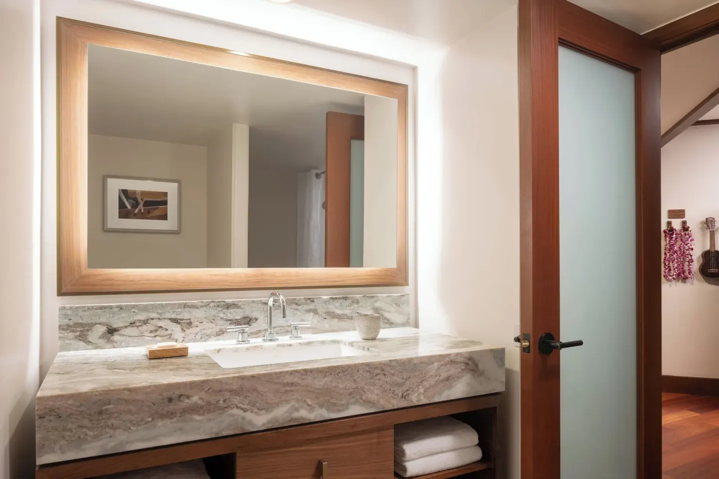 Suite bathroom vanity with marble counter and large mirror at Wailea Beach Resort - Marriott, Maui.