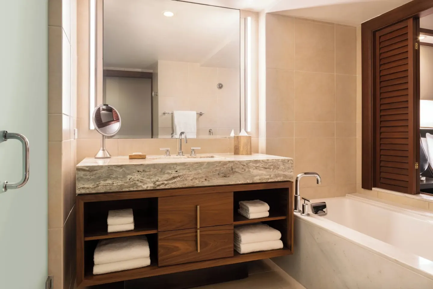 Suite bathroom with vanity, soaking tub, and towels at Wailea Beach Resort - Marriott, Maui.