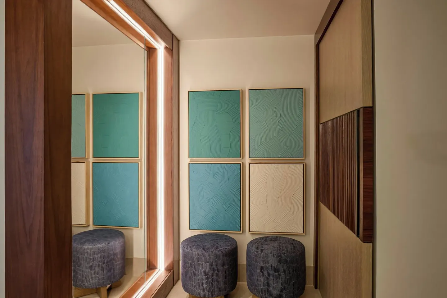 Suite dressing area with wall art and stools at Wailea Beach Resort - Marriott, Maui.