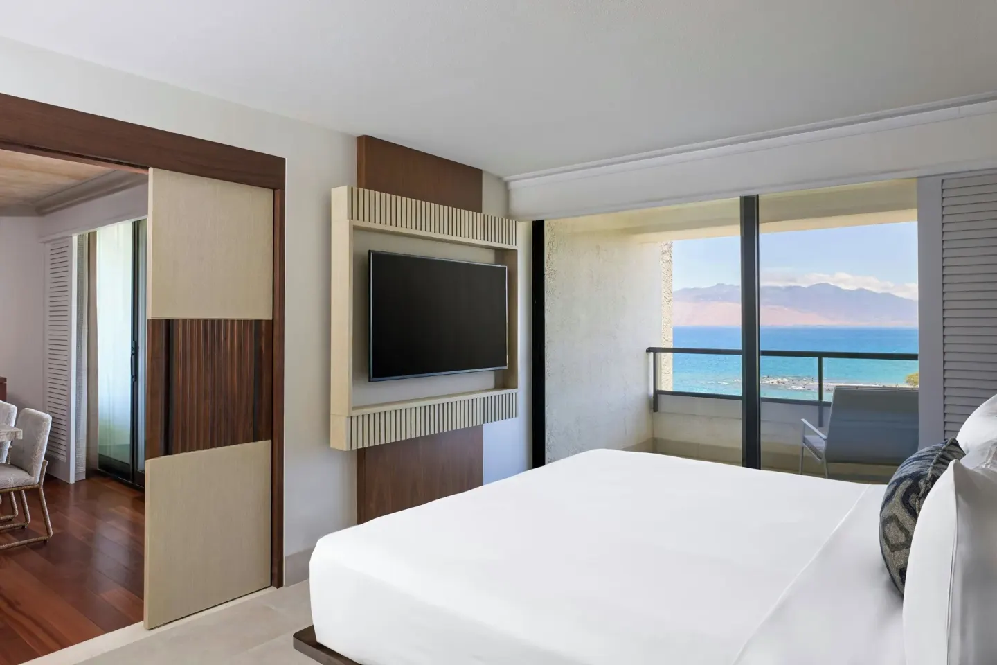Suite bedroom with king bed, TV, balcony, and ocean view at Wailea Beach Resort - Marriott, Maui.