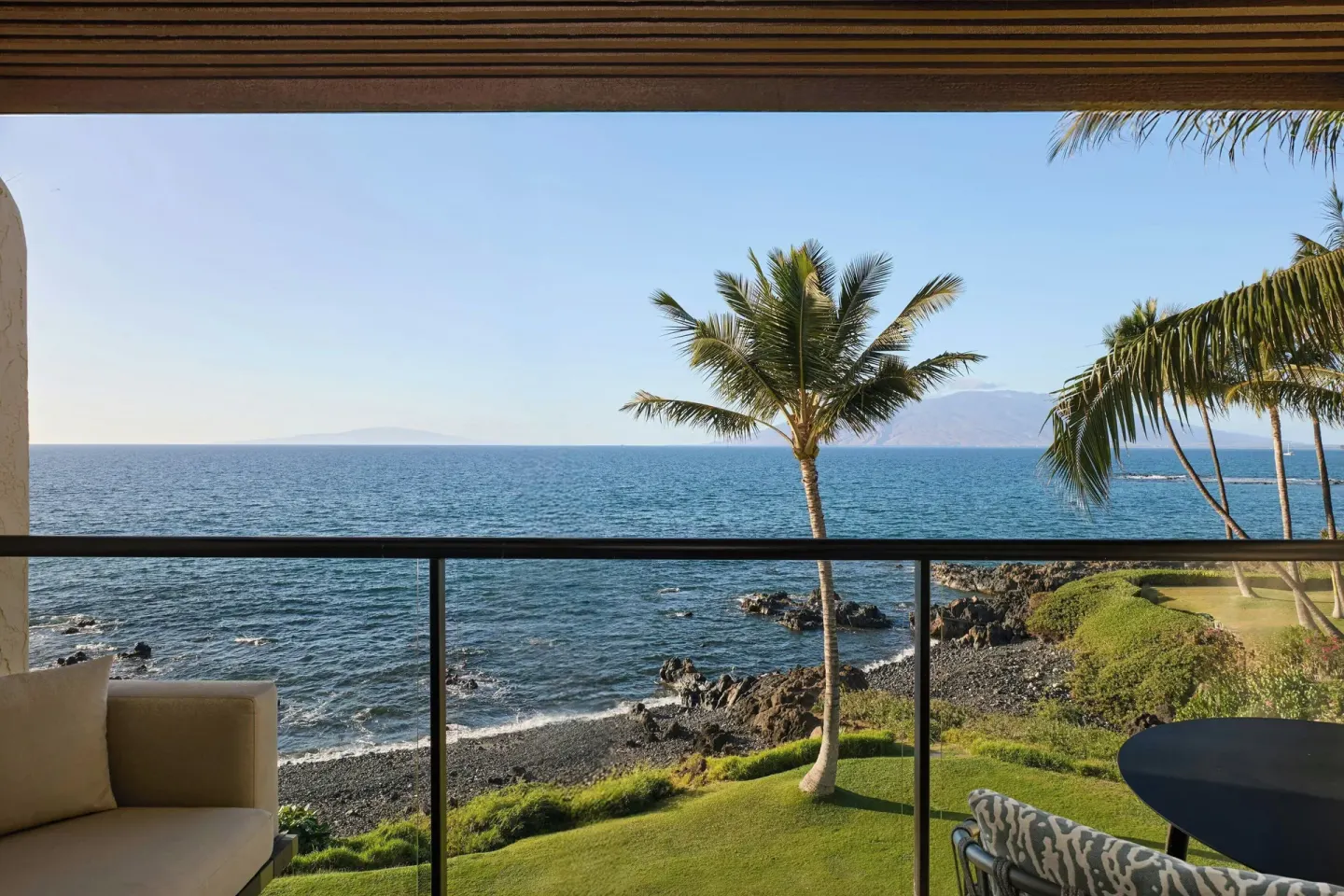 Oceanfront balcony view with palm trees at Wailea Beach Resort - Marriott, Maui.