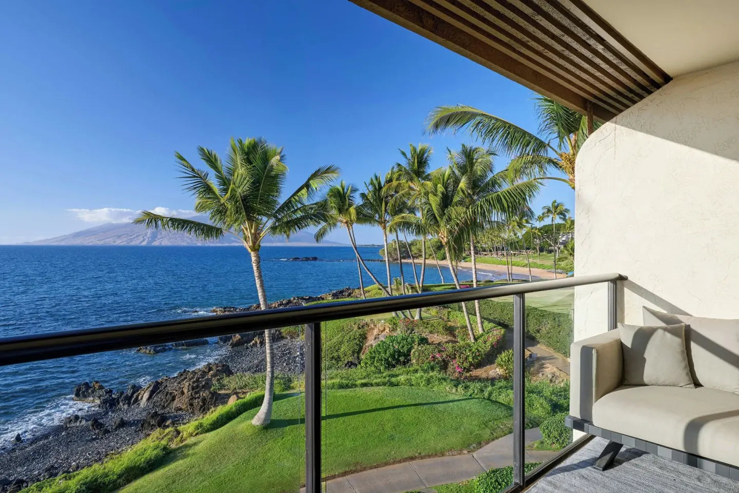 Oceanfront balcony with palms and shoreline at Wailea Beach Resort - Marriott, Maui.