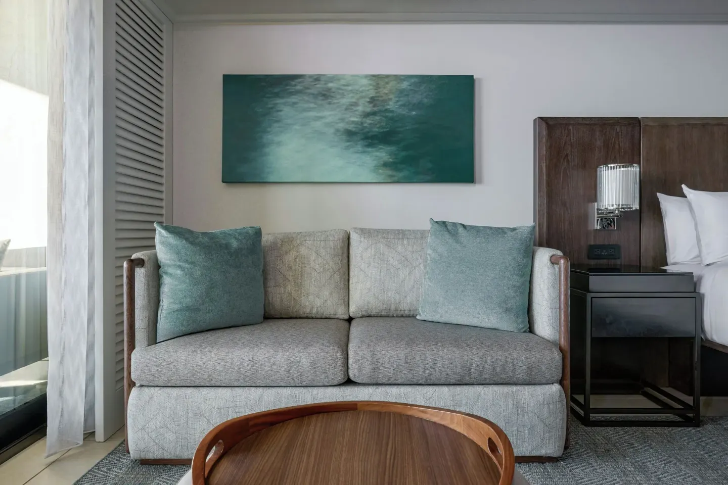 Sofa seating area beside a king bed in an oceanfront room at Wailea Beach Resort - Marriott, Maui.