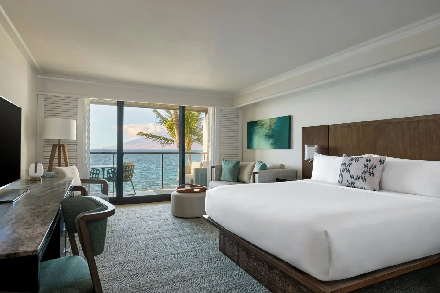 Oceanfront king room with bed, desk, sofa and balcony at Wailea Beach Resort - Marriott, Maui.