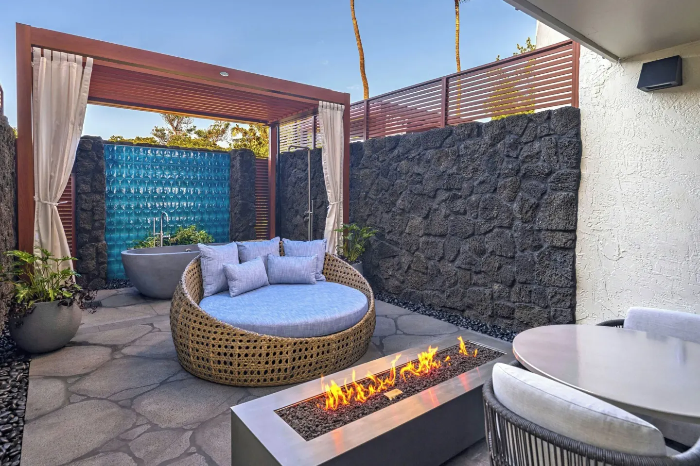 Garden Oasis lanai with fire pit, daybed, and tub at Wailea Beach Resort - Marriott, Maui.