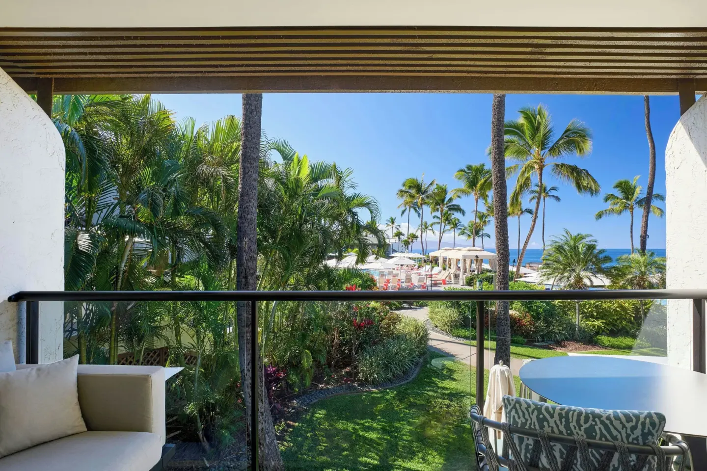 Furnished balcony with garden, palms and ocean glimpses at Wailea Beach Resort - Marriott, Maui.