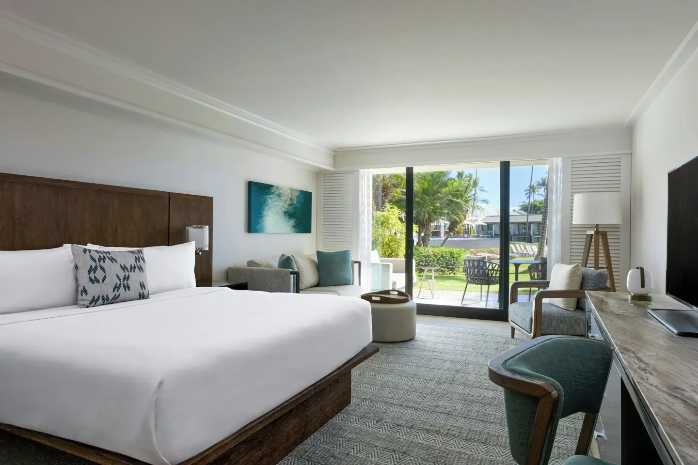 King bed room with sofa bed, desk, TV, and balcony at Wailea Beach Resort - Marriott, Maui.