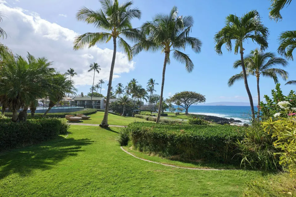 Partial ocean view lawn with palms from a balcony at Wailea Beach Resort - Marriott, Maui.