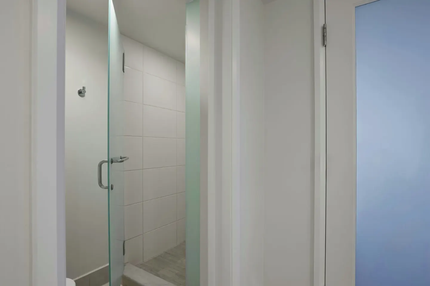 Suite bathroom shower with frosted glass door at Wailea Beach Resort - Marriott, Maui.