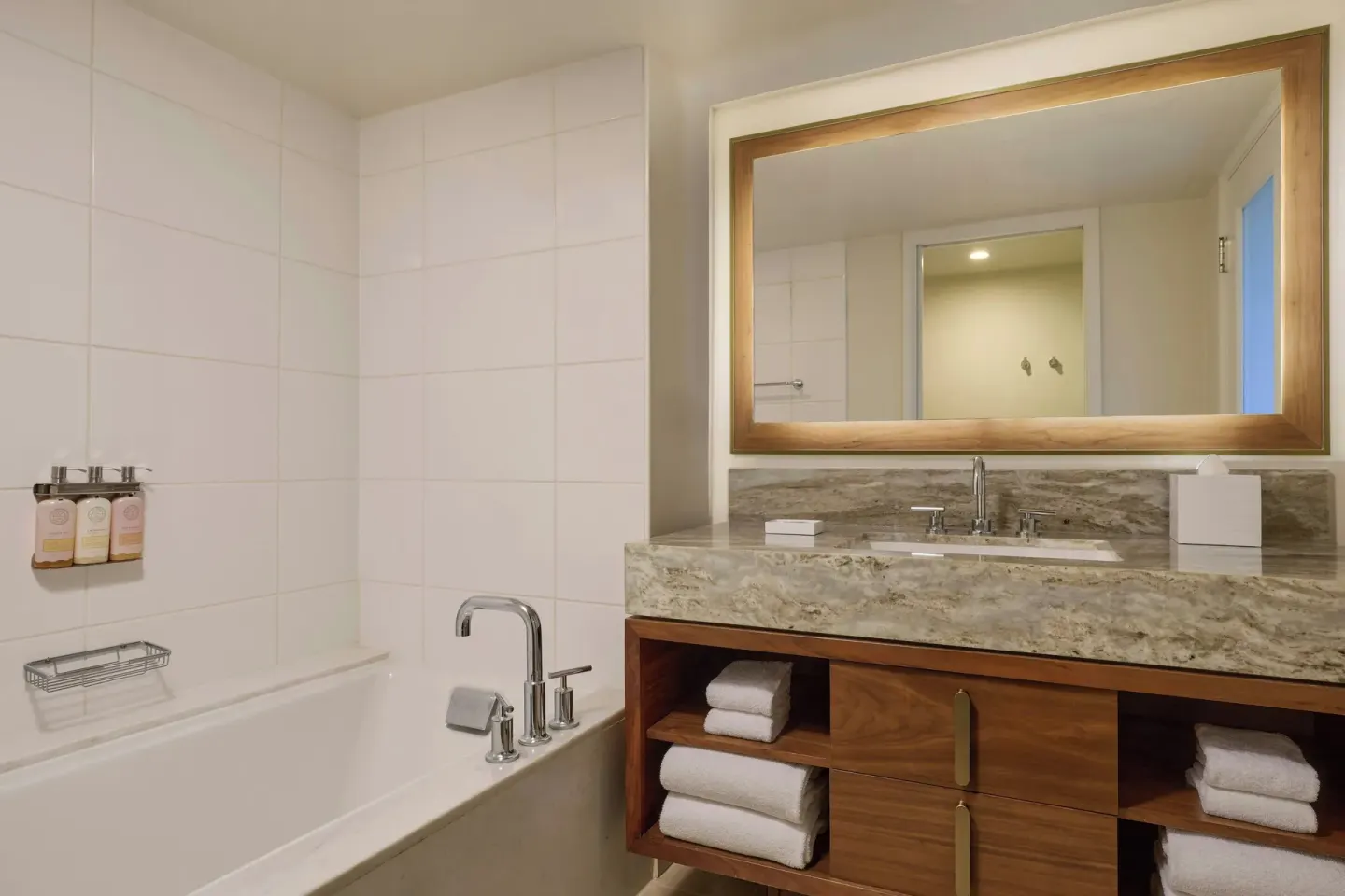 Suite bathroom with bathtub and stone vanity at Wailea Beach Resort - Marriott, Maui.