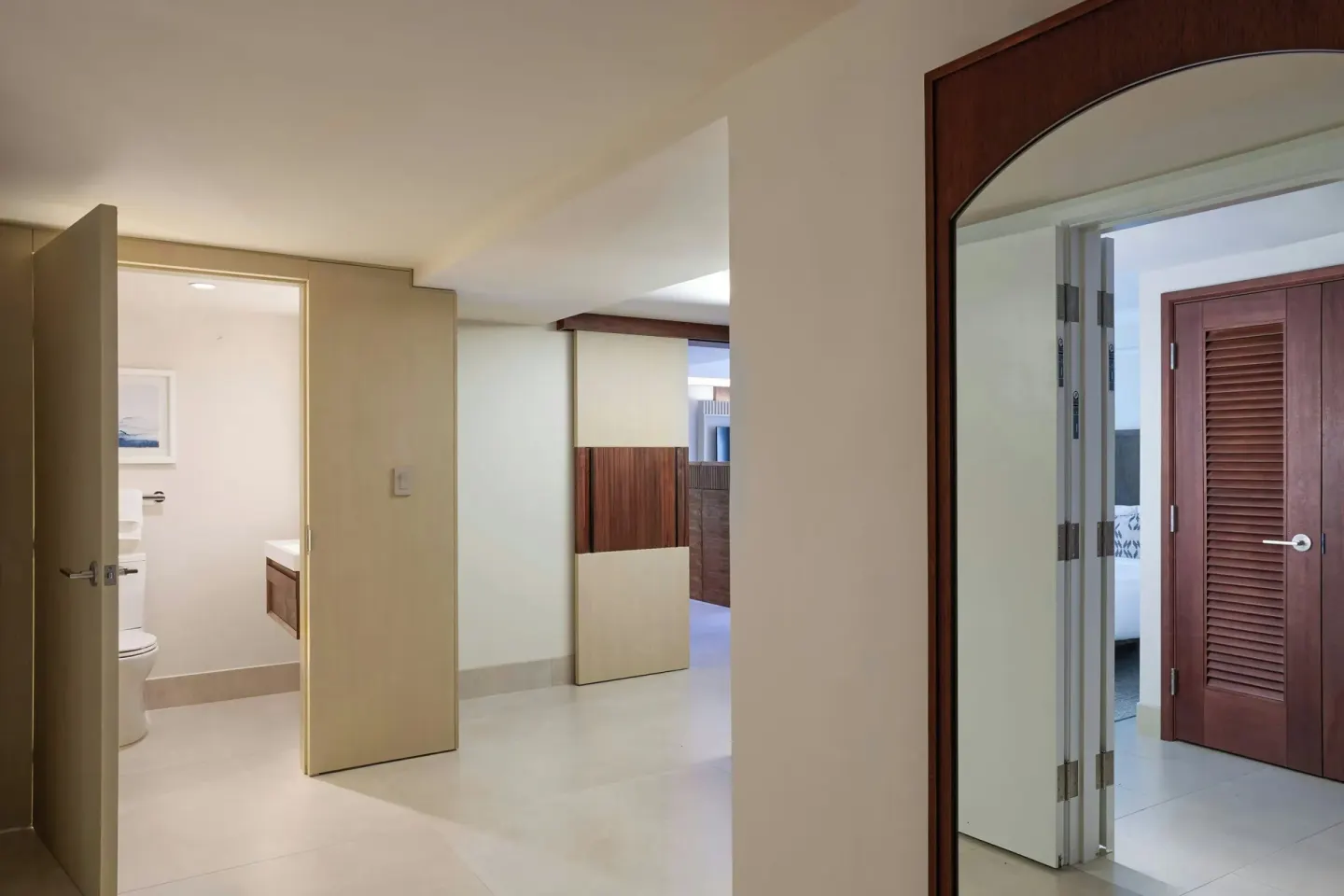 Villa entry, bath doorway, and bedroom reflection at Wailea Beach Resort - Marriott, Maui.