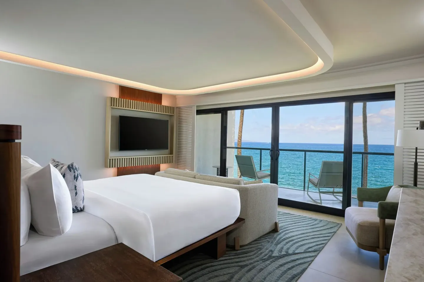 Oceanfront one-bedroom villa with bed and balcony at Wailea Beach Resort - Marriott, Maui.