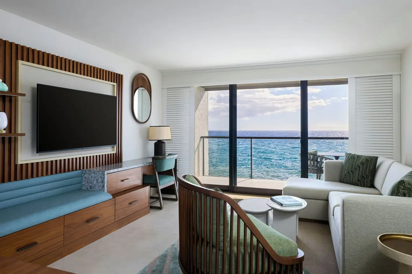 Oceanfront villa living area with TV and balcony at Wailea Beach Resort - Marriott, Maui.